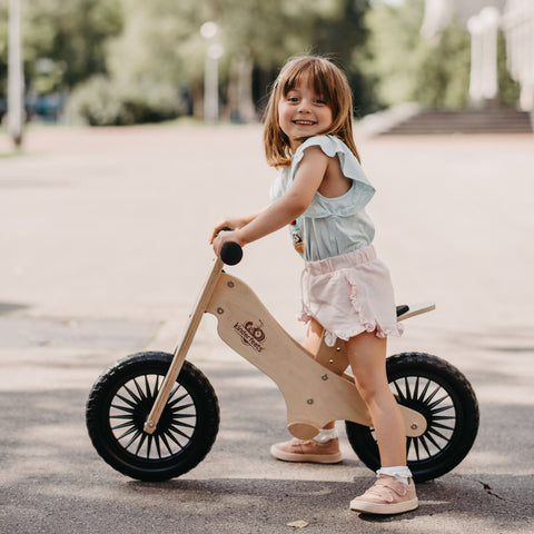 Kiddo Joy Balance Bike - Natural by Kinderfeets, an eco-friendly balance bike designed to promote balance, coordination, and motor skills development for young riders.