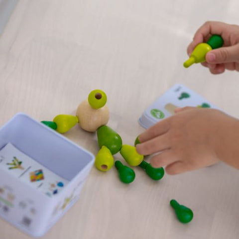 Kiddo Joy Balancing Cactus by PlanToys, an eco-friendly toy designed to promote fine motor skills, hand-eye coordination, and balance through fun stacking and balancing activities.