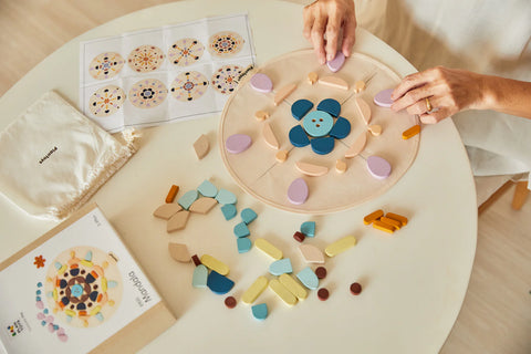 Kiddo Joy Mandela by PlanToys, an eco-friendly toy designed to foster creativity, problem-solving, and pattern recognition through fun, engaging mandala building activities.